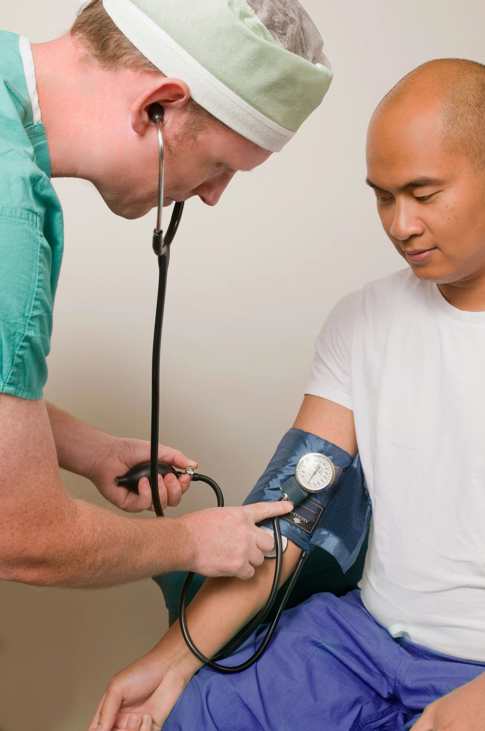 Clinician checking patient's blood pressure